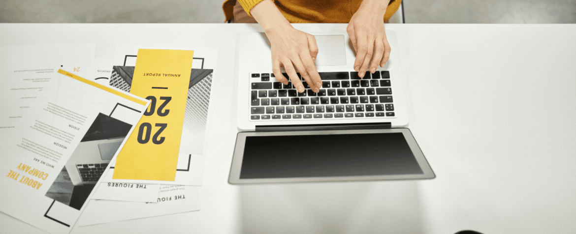 laptop and brochures